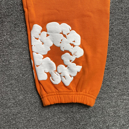 DENIM TEARS COTTON WREATH SWEATPANTS ORANGE