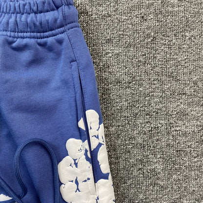 DENIM TEARS COTTON WREATH SWEATPANTS BLUE